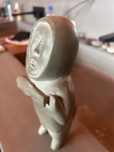 Inuit carving man and fish