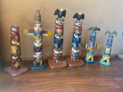 NWC Spence, Mark Black Bald Eagle atop with pole topped figure in arms of beaver, large 4 figured totem (Smaller of two)
