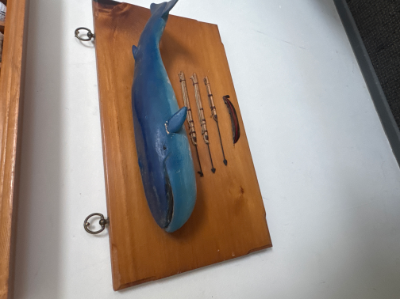 Folk art, blue whale with harpoon and boat