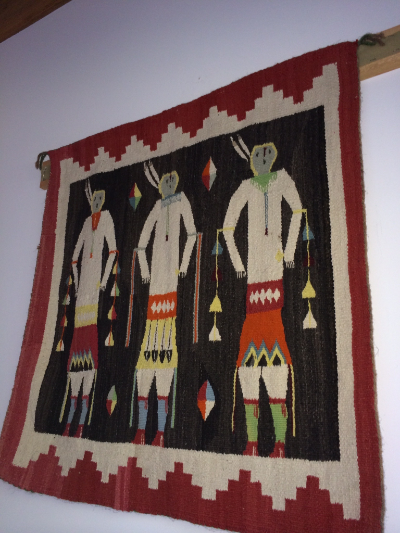 Navajo, rex and black background Yeibichei rug with three figures