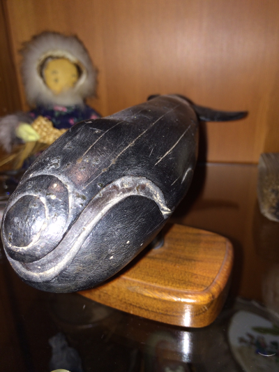 Vintage ebony right whale On wood base